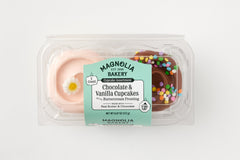 vanilla cupcake with pink buttercream topped with a daisy decon and chocolate cupcake with chocolate buttercream topped with confetti sprinkles in a clear plastic package.